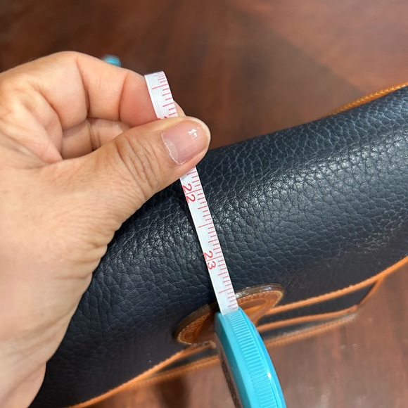 Dooney & Bourke Black and Tan Crossbody Bag with Signature Brass Lock - Picture 14 of 14